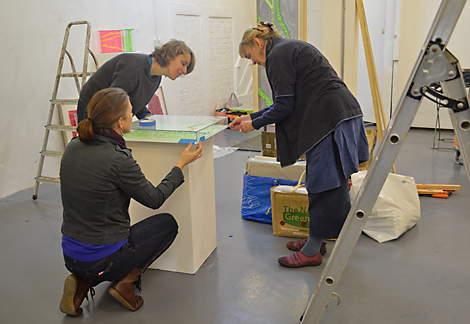 From left: Anna Glasbrook, Fiona Cassidy and Kirsten Glasbrook setting up