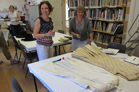 Desiree and Anna discussing BATMC I.09.396, Debebnham & Freebody, 1960 - 1969, silk synthetic, woven (brocade) quilted. 