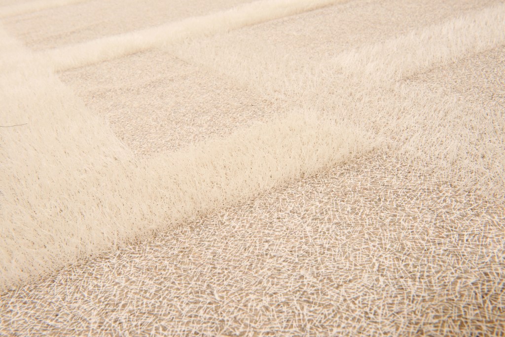 Wool fabric screenprinted and tufted.